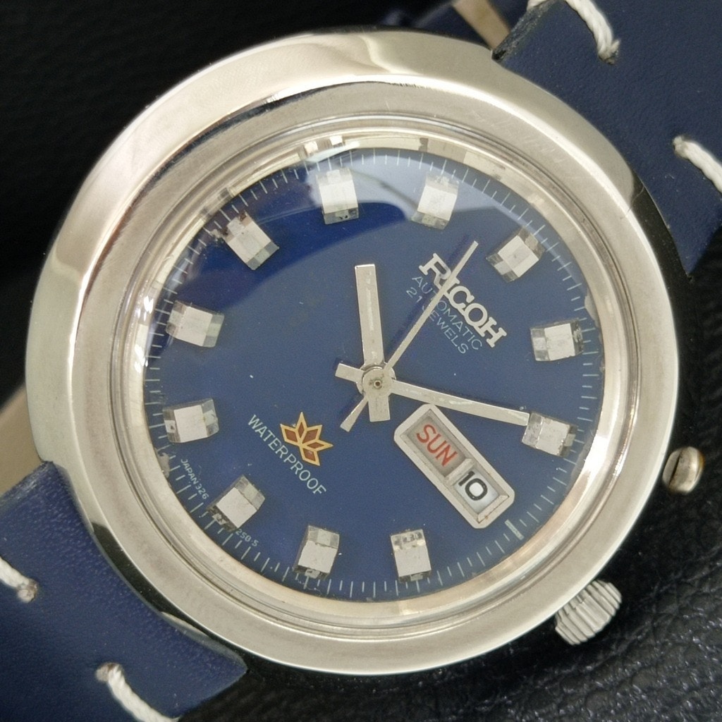 Vintage 1979 Ricoh Automatic Mens Silver Watch WDaydate  Blue Accents